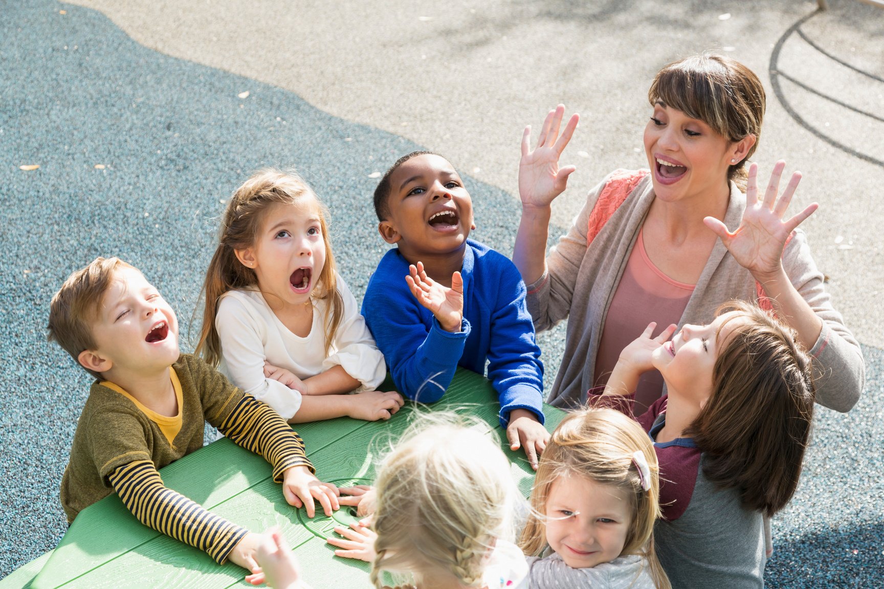 Teacher with preschool children having fun